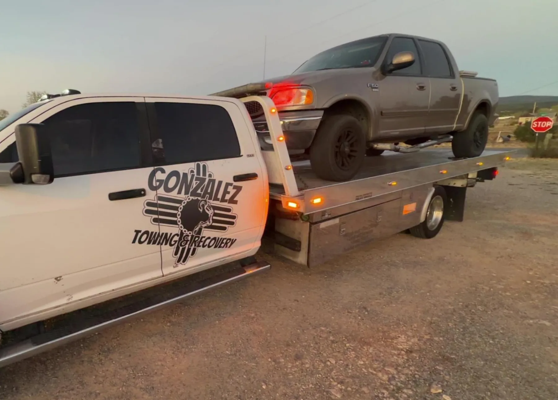 Tow truck transporting a vehicle